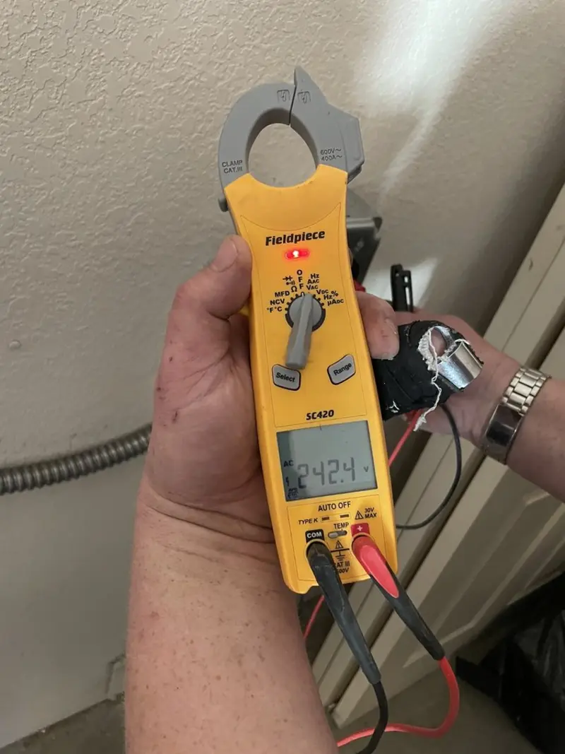 Voltage testing with clamp meter during Outlet Installation in Lucerne Valley